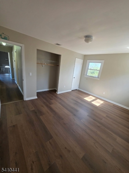14 Oliver Road Landing, NJ 07850 - Photo 9 of 17 an empty room with wooden floor and windows
