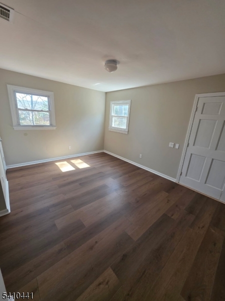 14 Oliver Road Landing, NJ 07850 - Photo 10 of 17 an empty room with wooden floor and windows