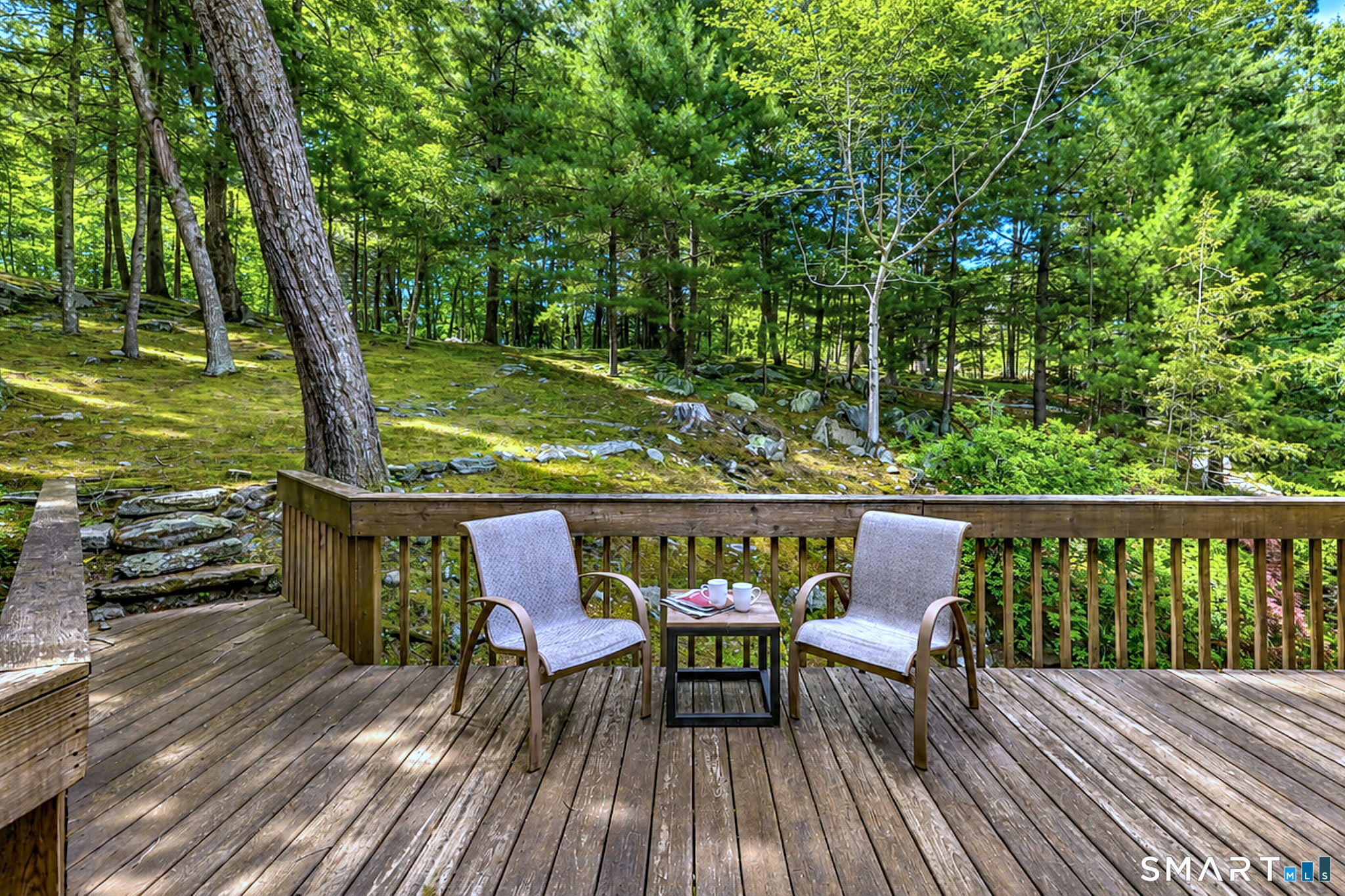 25 Milan Road Woodbridge, CT 06525 - Photo 21 of 40 a view of a chairs and table on the wooden deck