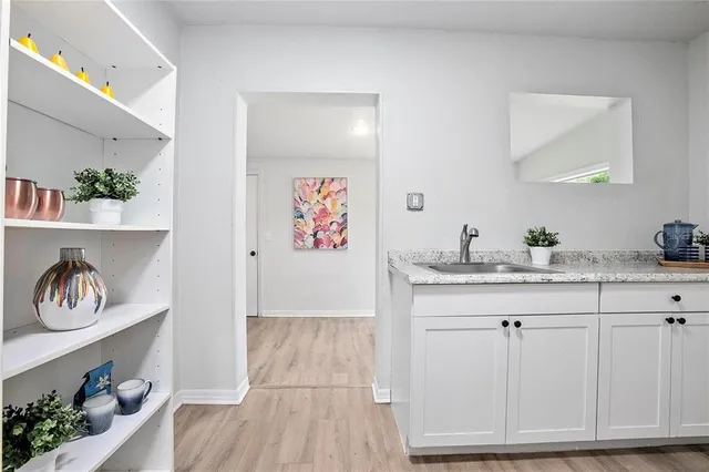 a bathroom with a sink a vanity and a mirror