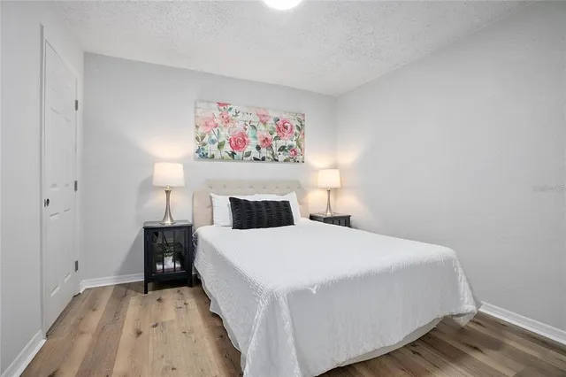 a bedroom with a bed and a table