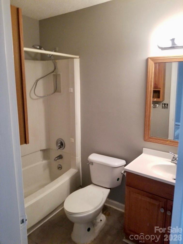 11027 Harrowfield Road Charlotte, NC 28226 - Photo 10 of 15 a white toilet sitting next to a bathtub