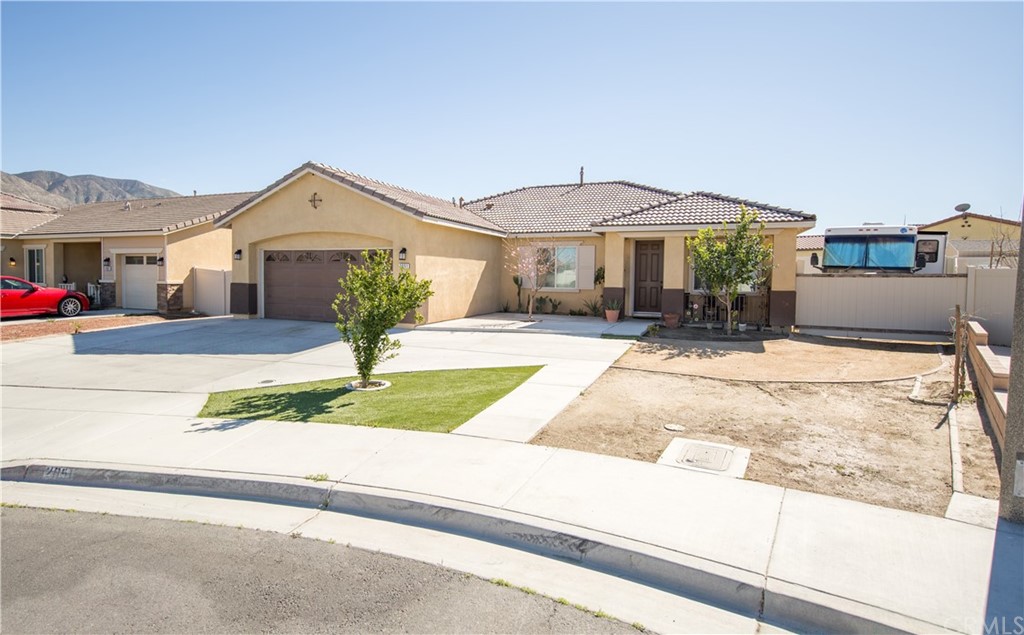 a front view of a house with yard