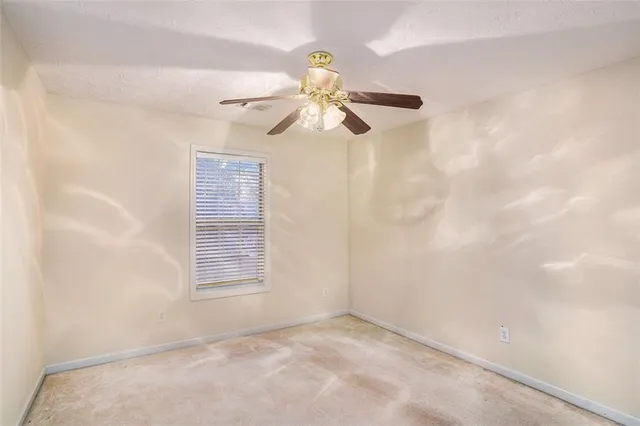 a view of a chandelier fan in a room
