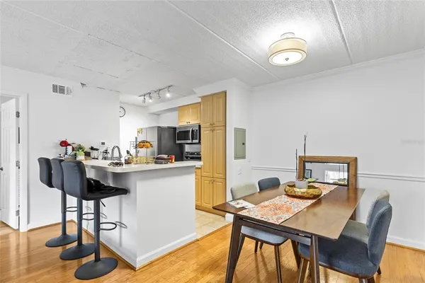 a view of a dining room with furniture and wooden floor