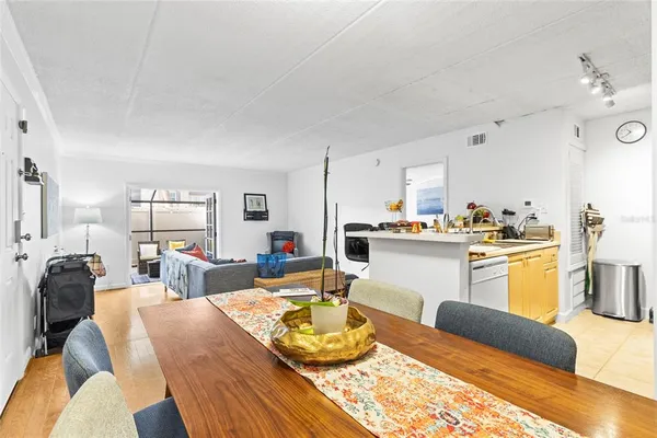 a kitchen with a refrigerator and a stove top oven