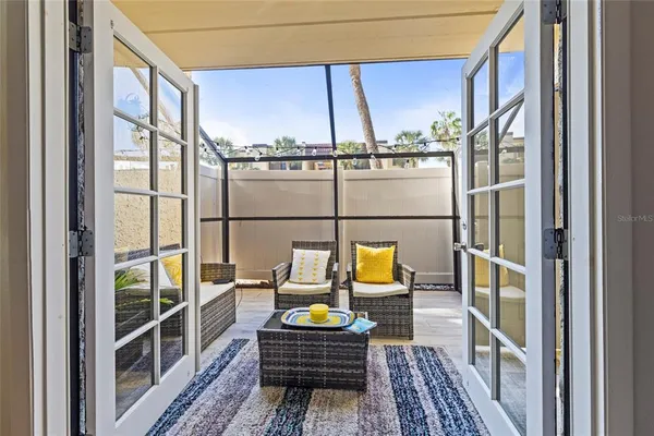 a house view with a garden and outdoor seating
