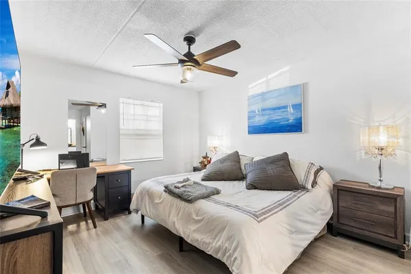 a bedroom with a bed and a table