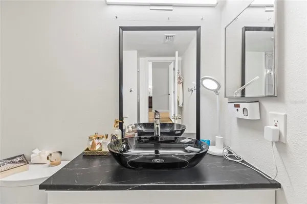 a bathroom with a sink and a mirror