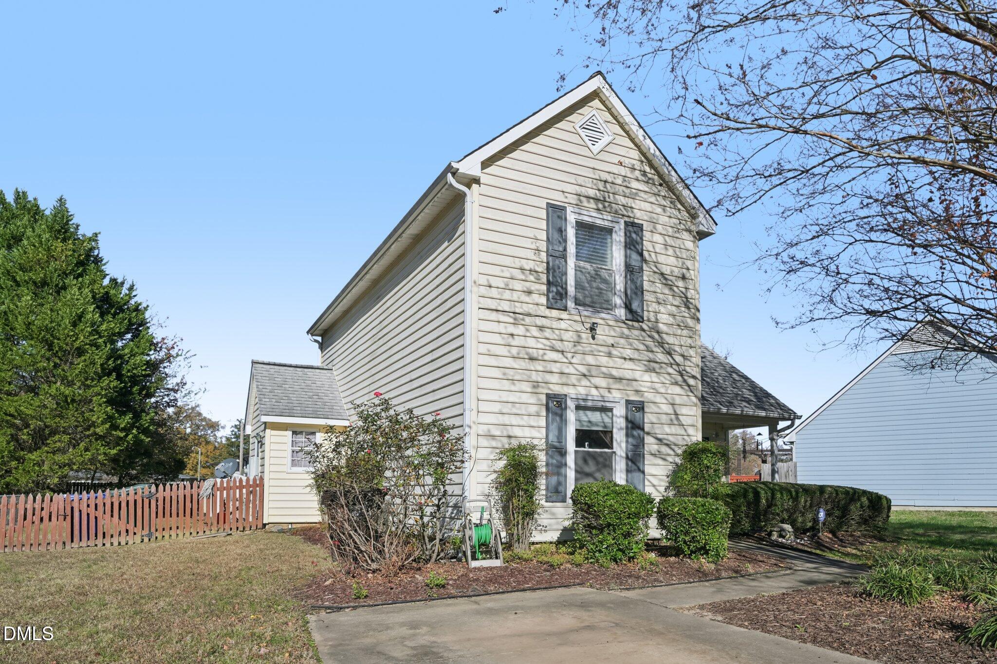 2706 Ramblegate Lane Durham, NC 27705 - Photo 1 of 28 a view of house with a yard and a garage