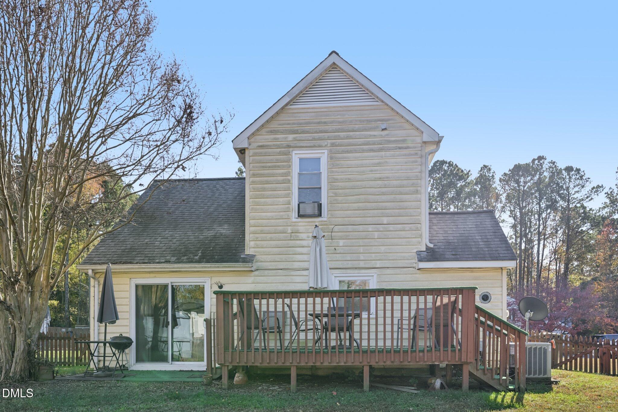 2706 Ramblegate Lane Durham, NC 27705 - Photo 22 of 28 a front view of a house with a garden