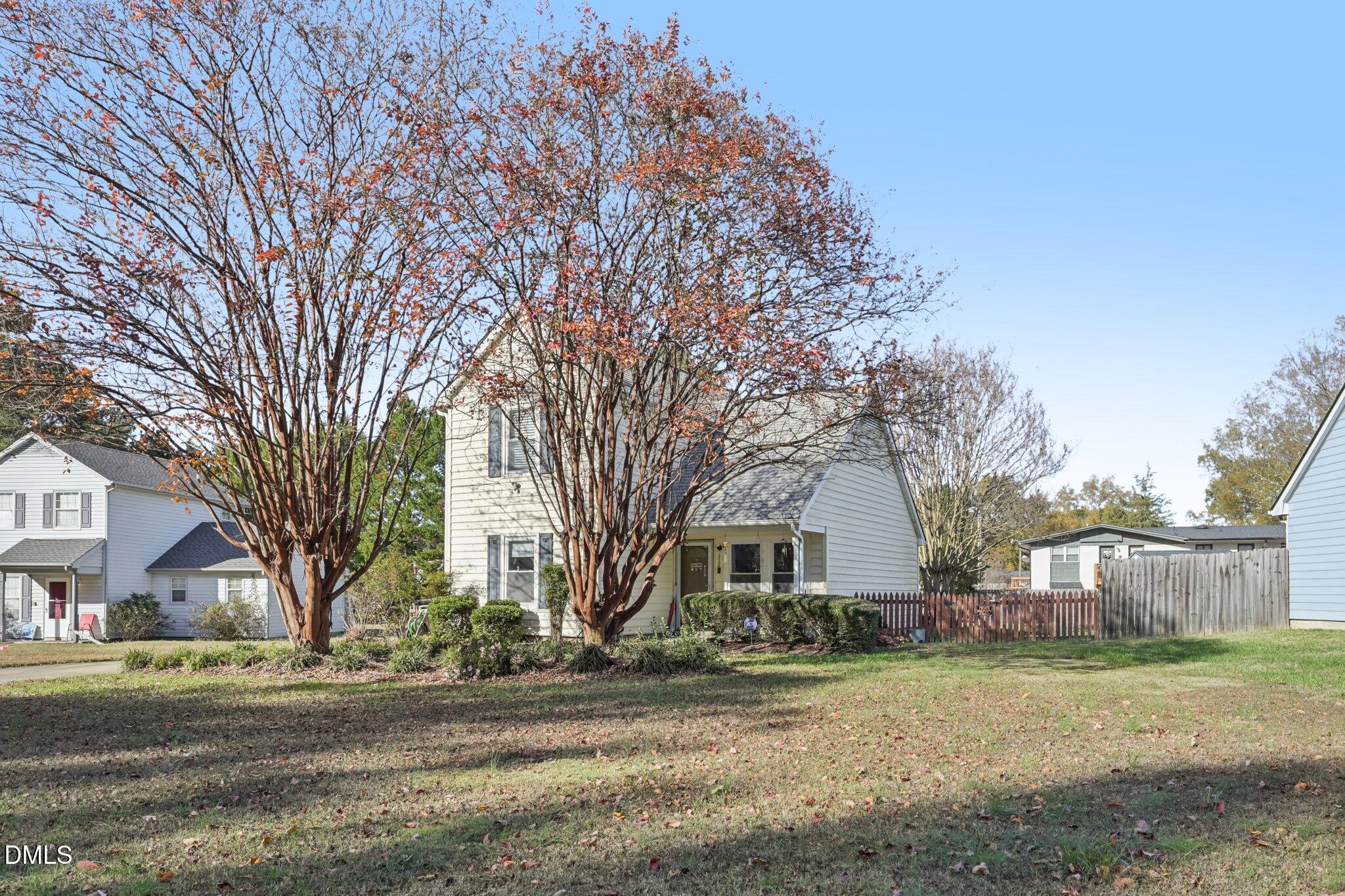 2706 Ramblegate Lane Durham, NC 27705 - Photo 25 of 28 a view of a yard with a large tree
