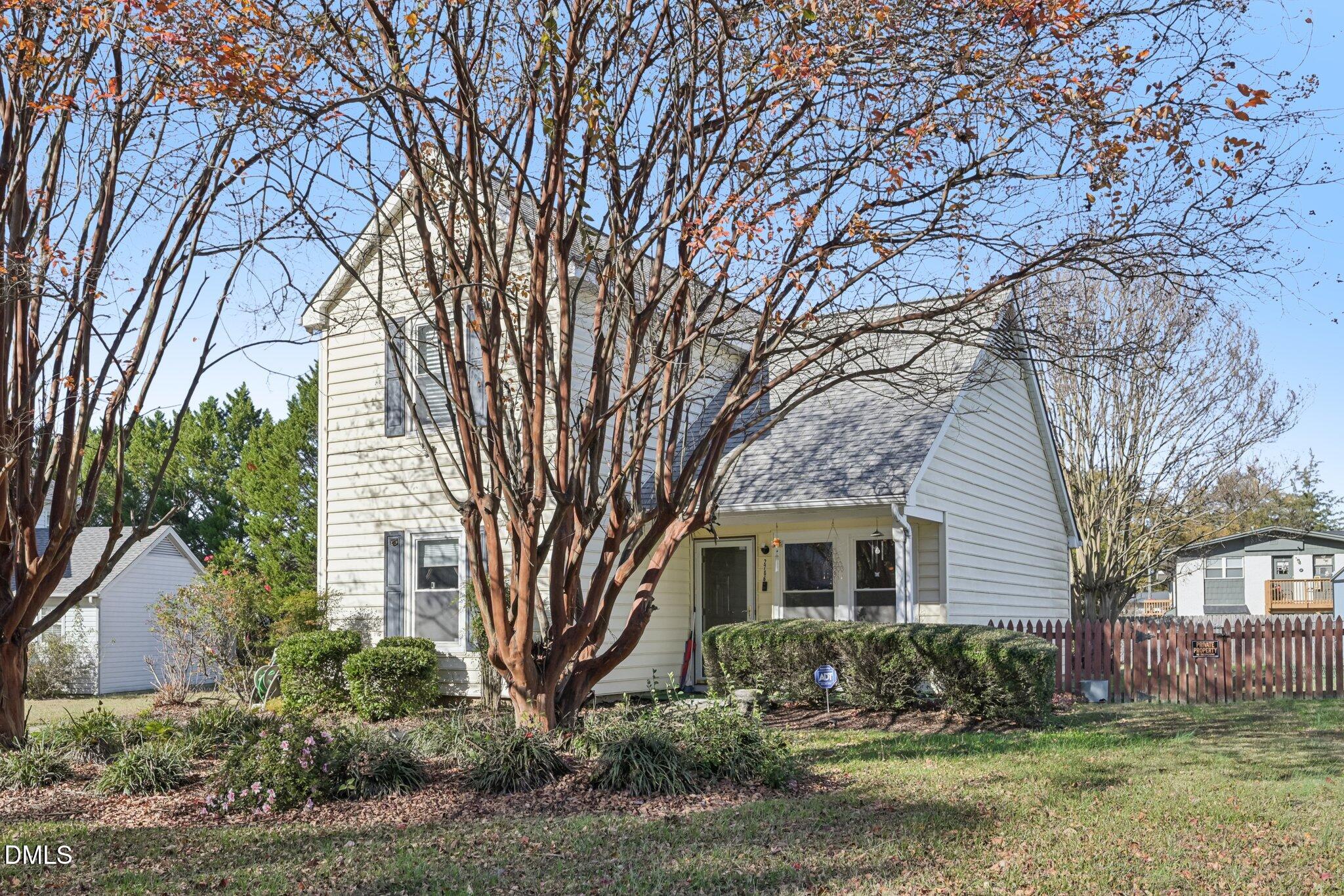 2706 Ramblegate Lane Durham, NC 27705 - Photo 26 of 28 a front view of a house with garden