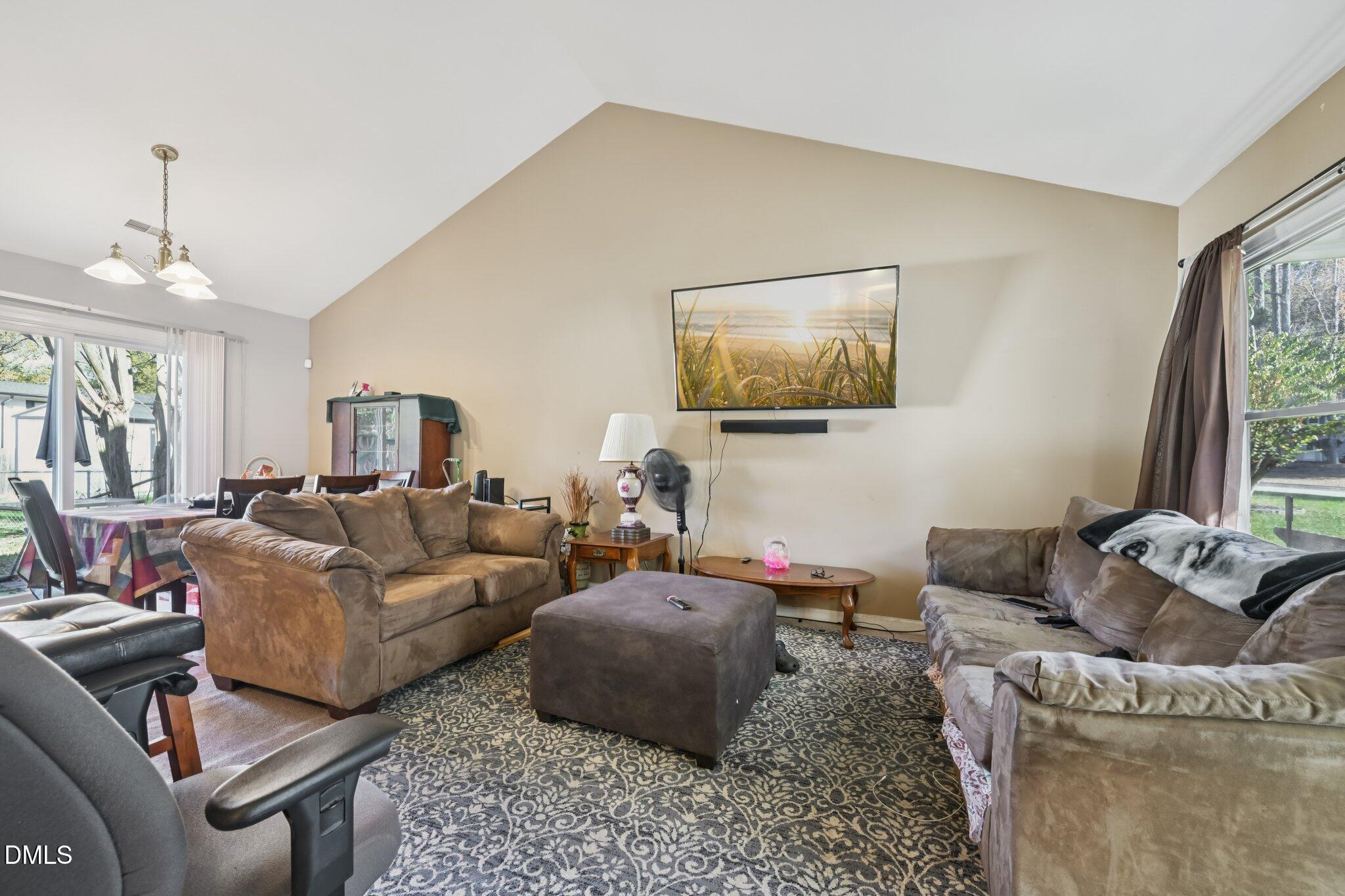 2706 Ramblegate Lane Durham, NC 27705 - Photo 2 of 28 a living room with furniture and a window
