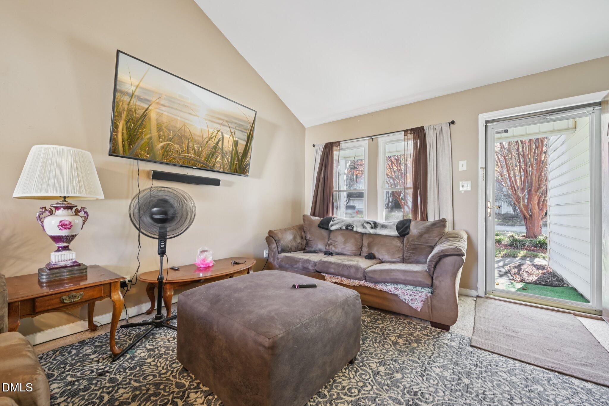 2706 Ramblegate Lane Durham, NC 27705 - Photo 3 of 28 a living room with furniture and a large window