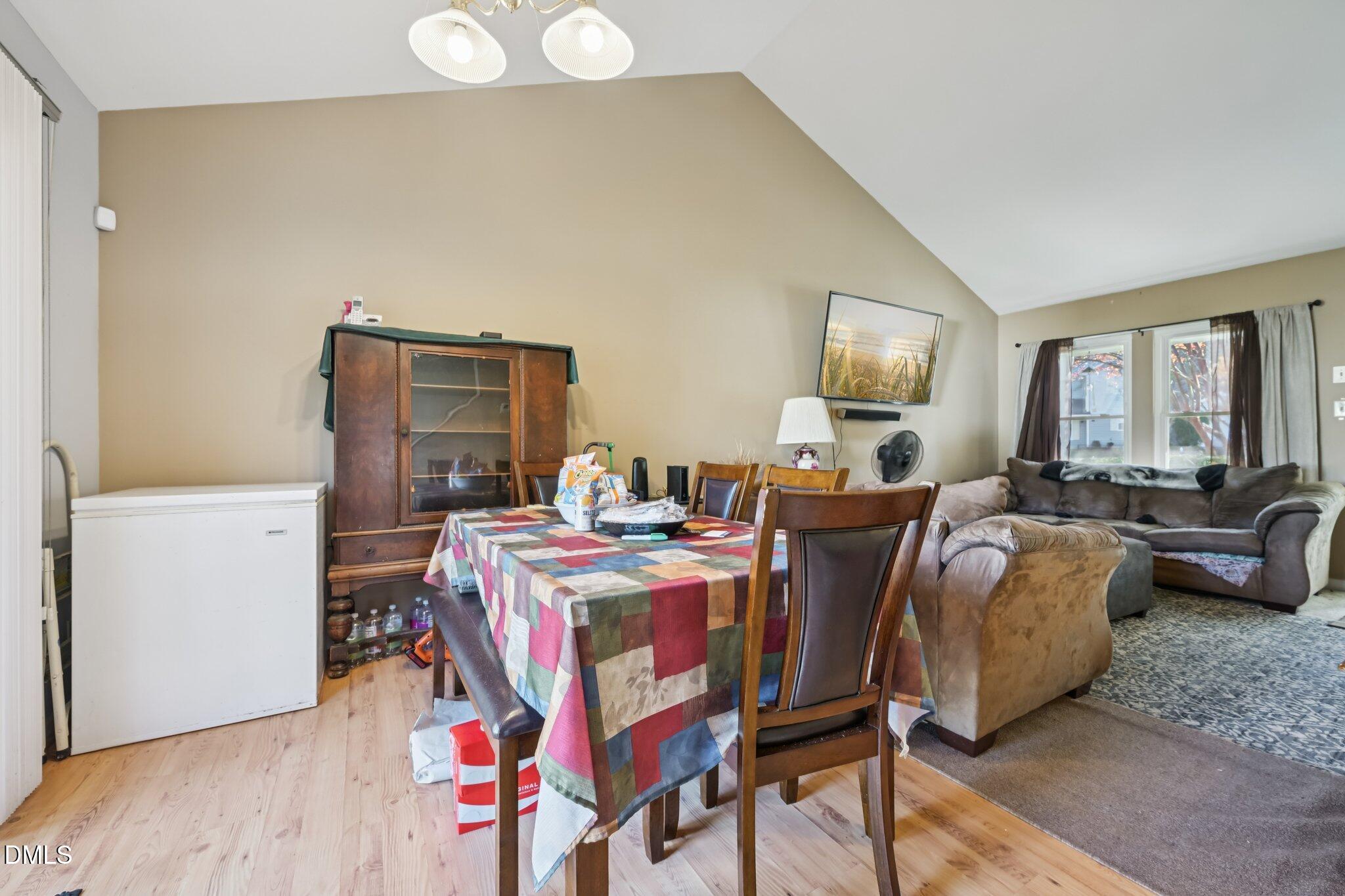 2706 Ramblegate Lane Durham, NC 27705 - Photo 4 of 28 a living room with furniture and a wooden floor