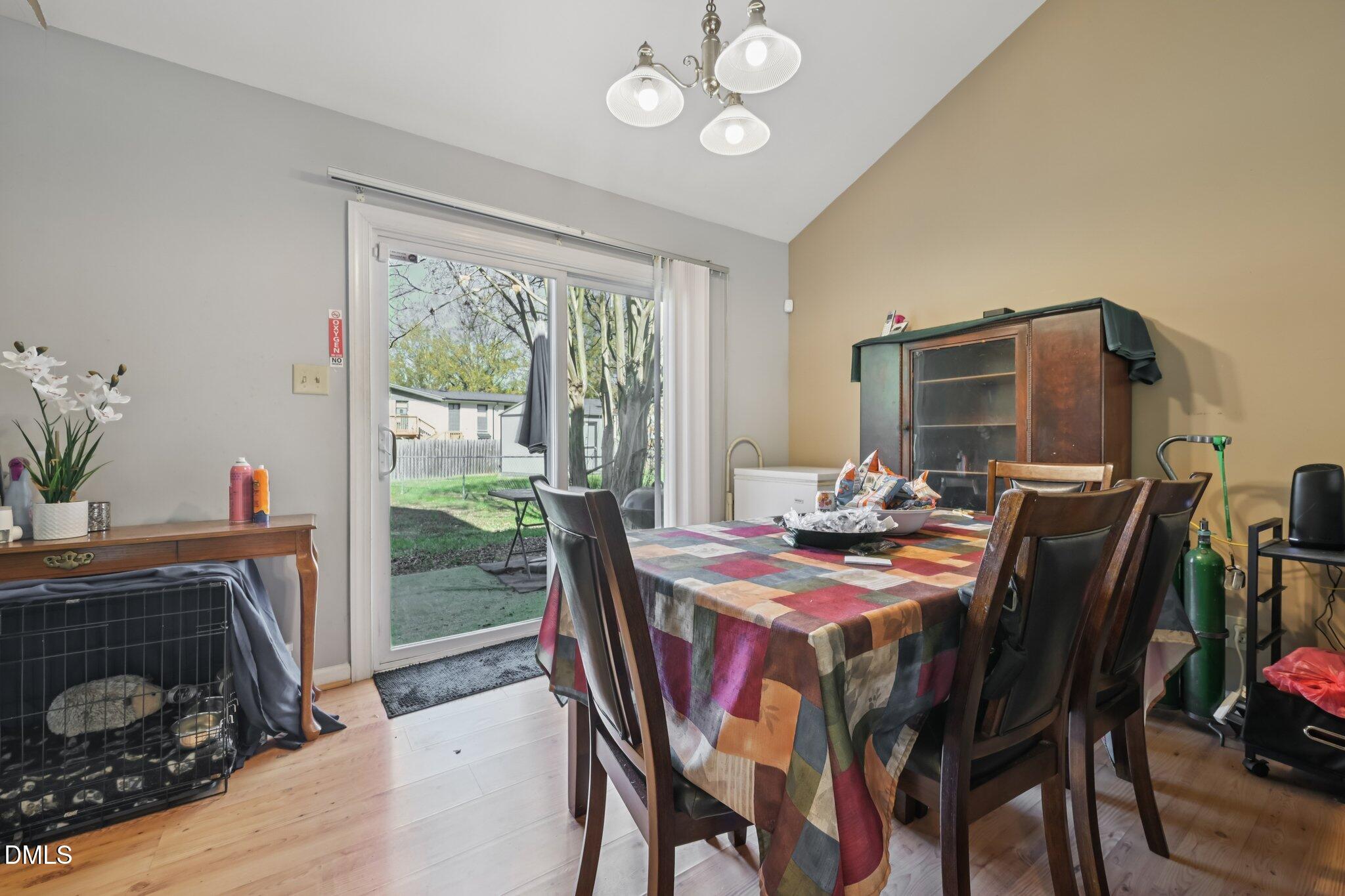 2706 Ramblegate Lane Durham, NC 27705 - Photo 5 of 28 a view of a dining room with furniture window and outside view