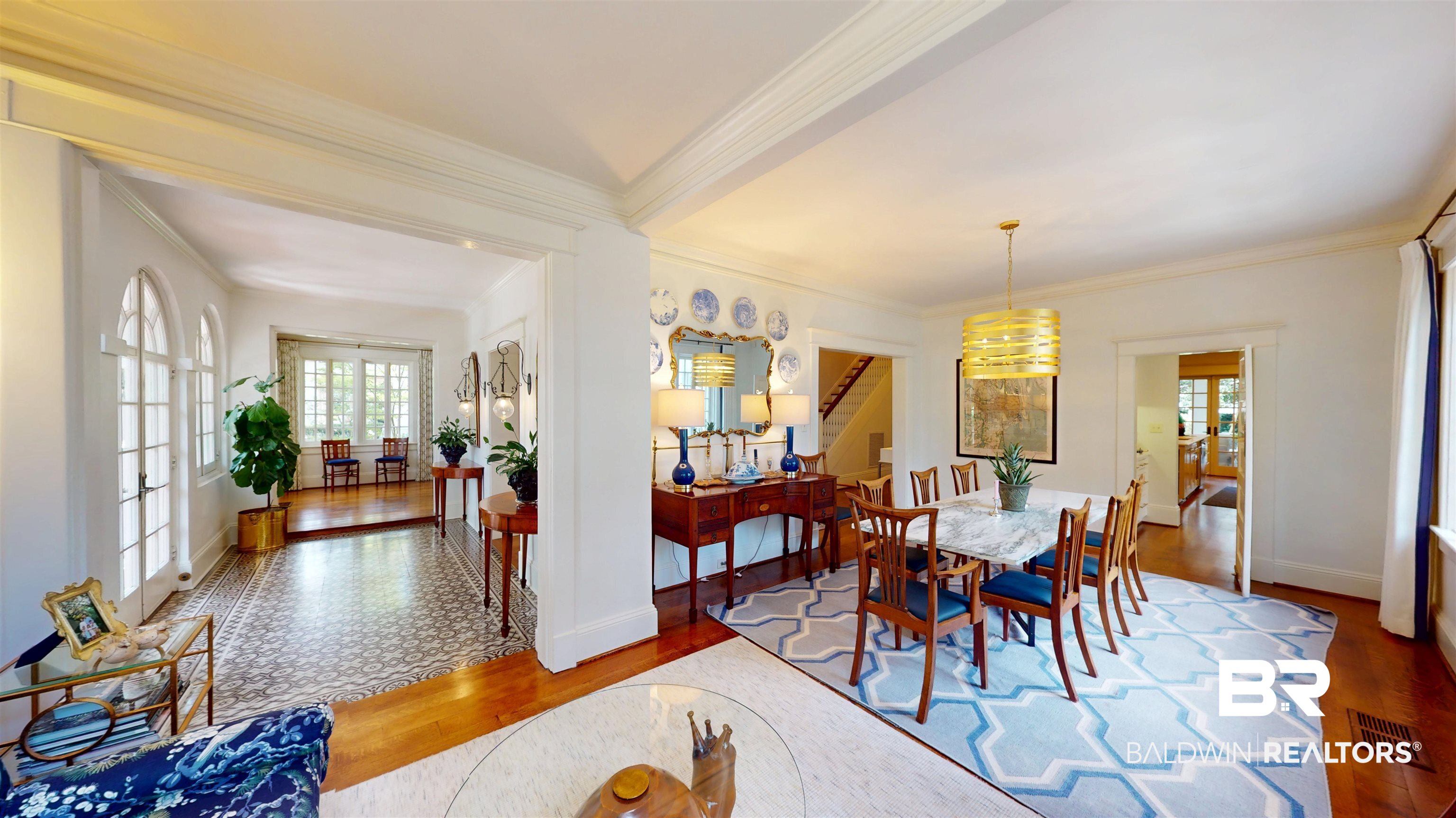 211 Lanier Avenue Mobile, AL 36607 - Photo 27 of 73 Dining space featuring wood finished floors, ornamental molding, and a chandelier