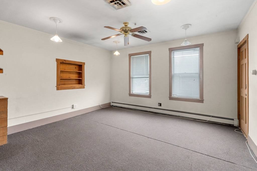 301 River Street Waltham, MA 02453 - Photo 3 of 20 a view of an empty room with a window