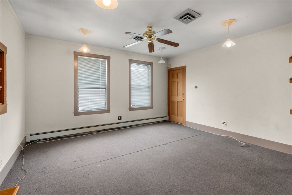 301 River Street Waltham, MA 02453 - Photo 5 of 20 an empty room with fan and windows