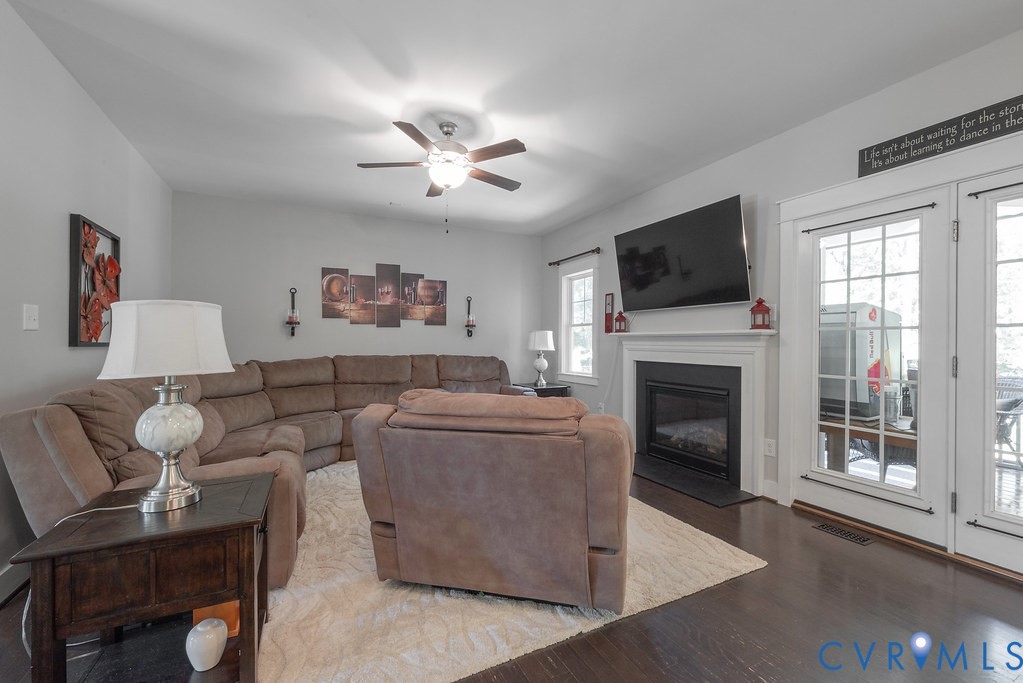 6446 Chestnut Church Road Mechanicsville, VA 23116 - Photo 17 of 49 Living area featuring dark wood-finish flooring, a