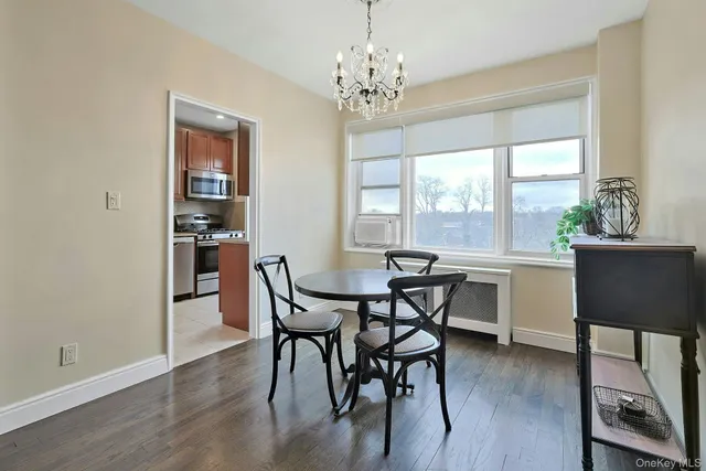a view of a dining room with furniture and window