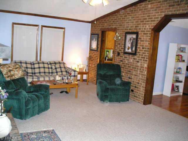 5518 Murphy Road Summerfield, NC 27358 - Photo 5 of 7 Other. Great room has cathedral ceiling and wood burning fireplace