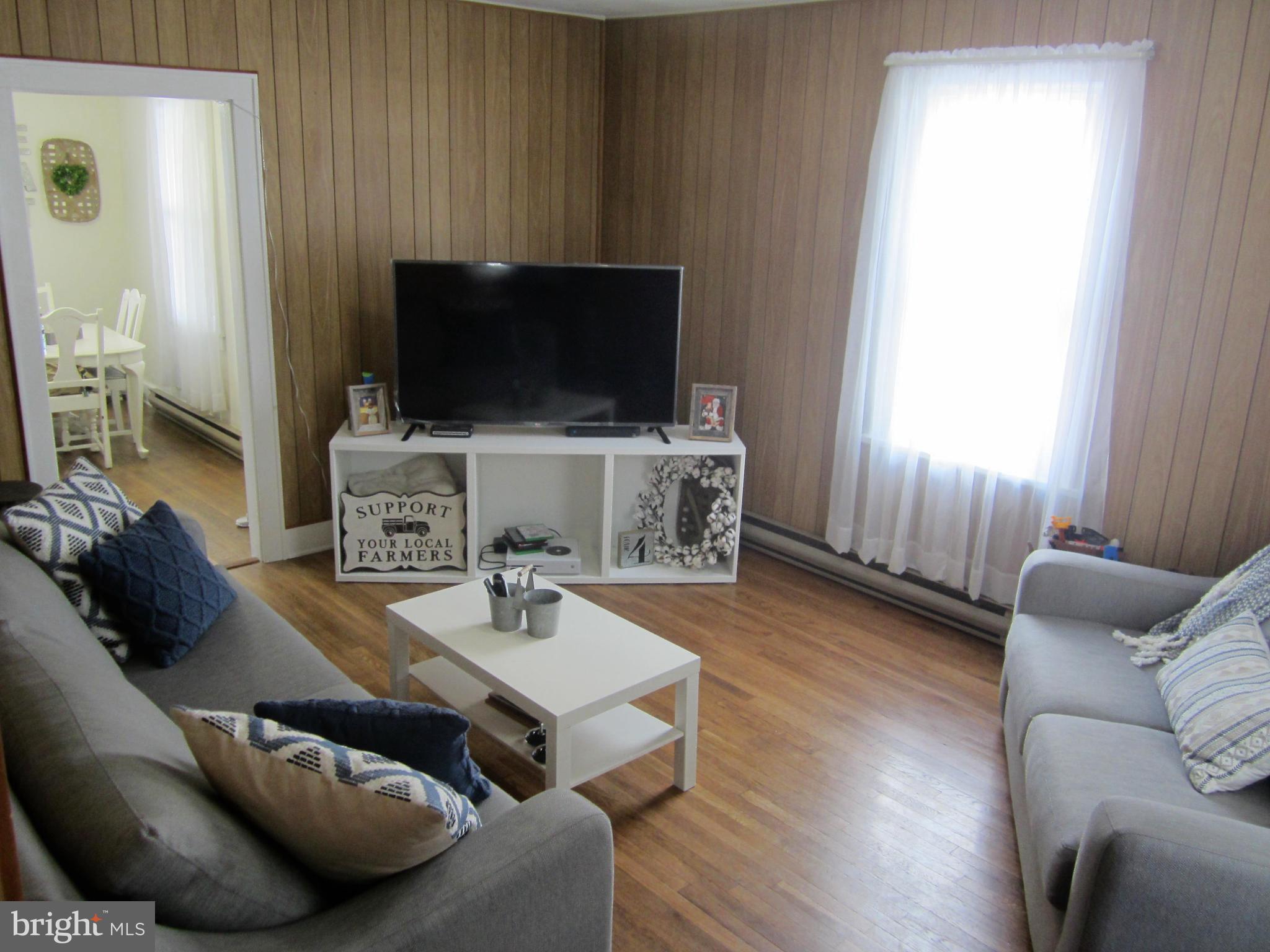 925 West Water Street Bellefonte, PA 16823 - Photo 13 of 23 a living room with furniture and a flat screen tv