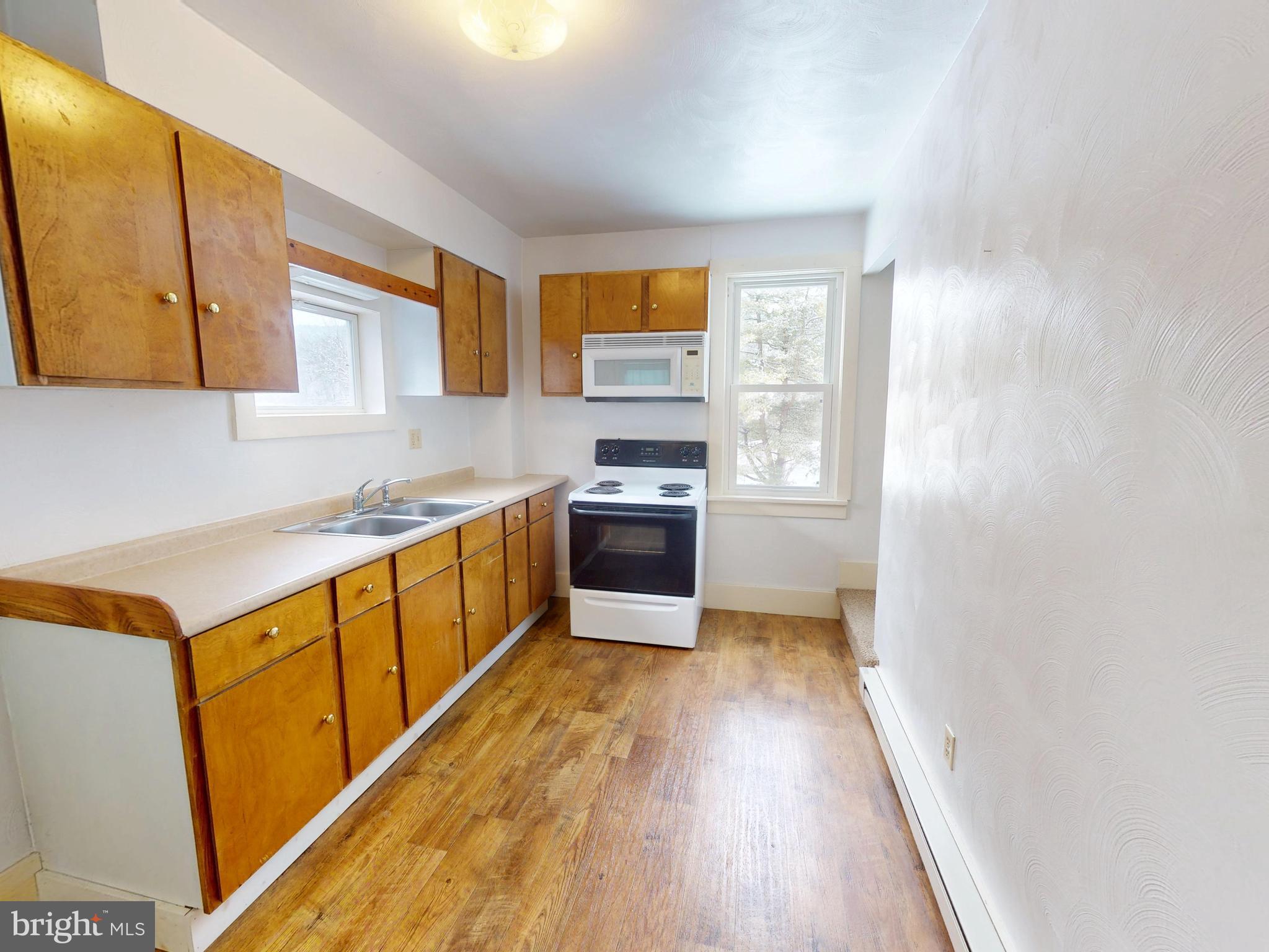 925 West Water Street Bellefonte, PA 16823 - Photo 5 of 23 a kitchen with stainless steel appliances granite countertop a stove a sink and a refrigerator