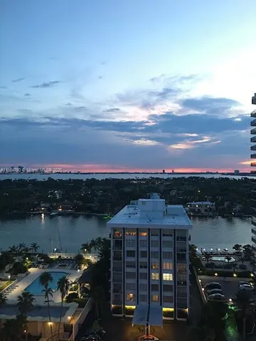 a view of a lake in front of a house