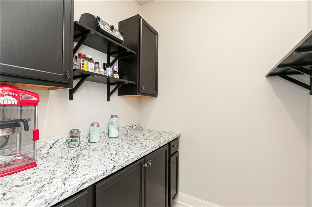 152 Greatwood Lane Villa Rica, GA 30180 - Photo 13 of 48 a kitchen with a sink cabinets and a window