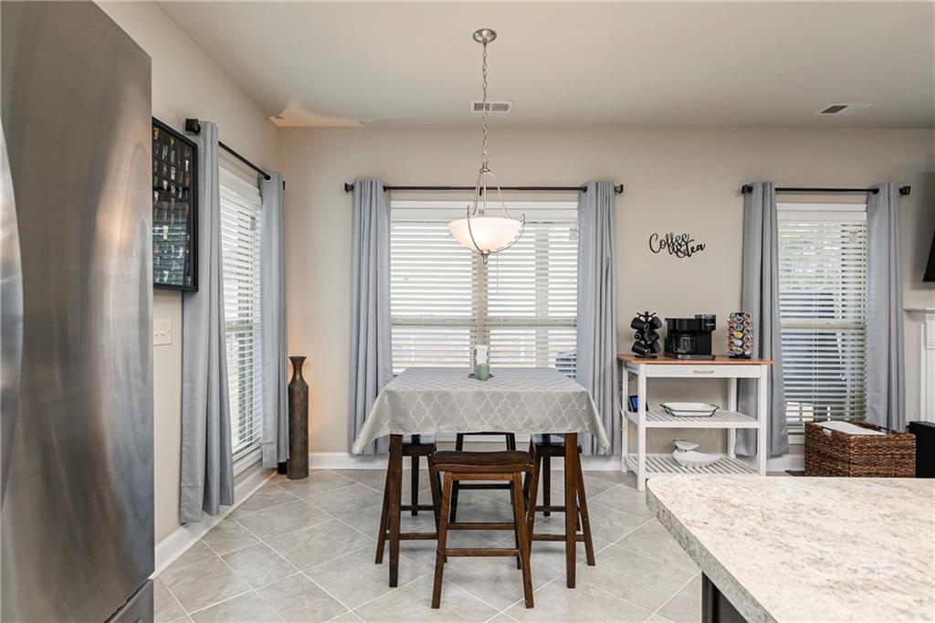 152 Greatwood Lane Villa Rica, GA 30180 - Photo 14 of 48 a dining room with furniture and window