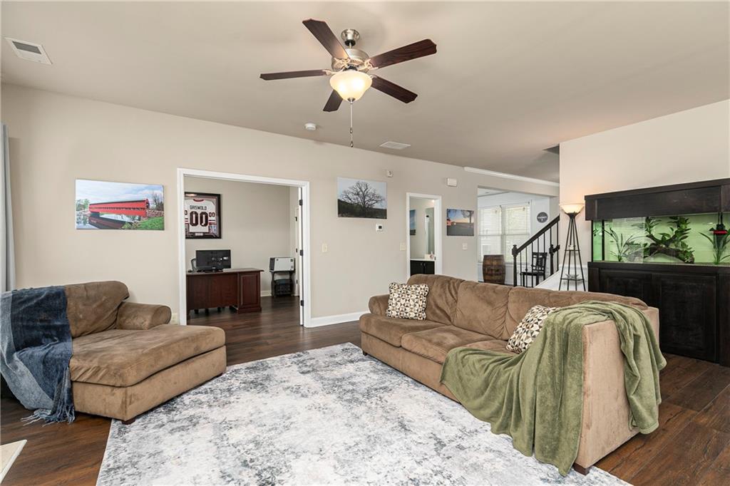 152 Greatwood Lane Villa Rica, GA 30180 - Photo 17 of 48 a living room with furniture and a flat screen tv