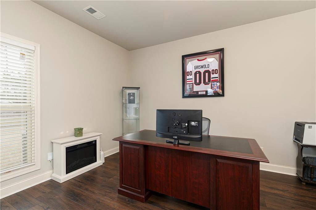 152 Greatwood Lane Villa Rica, GA 30180 - Photo 19 of 48 a view of a workspace with furniture and wooden floor