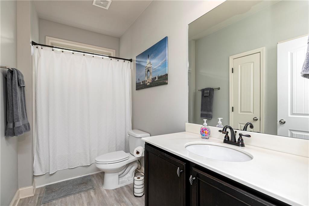 152 Greatwood Lane Villa Rica, GA 30180 - Photo 20 of 48 a bathroom with a granite countertop sink toilet and shower