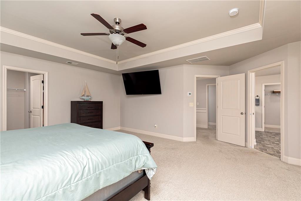 152 Greatwood Lane Villa Rica, GA 30180 - Photo 25 of 48 a bedroom with a bed and a flat screen tv