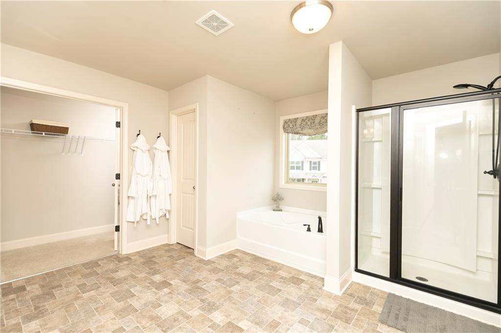 152 Greatwood Lane Villa Rica, GA 30180 - Photo 28 of 48 a view of a bathroom with a tub shower and a sink