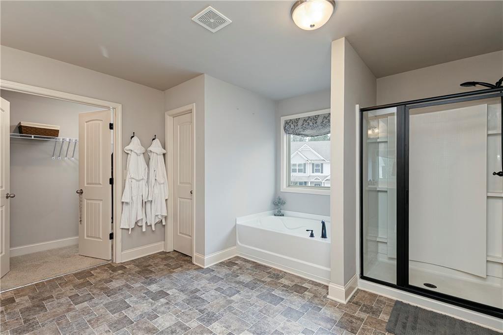 152 Greatwood Lane Villa Rica, GA 30180 - Photo 29 of 48 a view of a bathroom with a tub shower and a sink