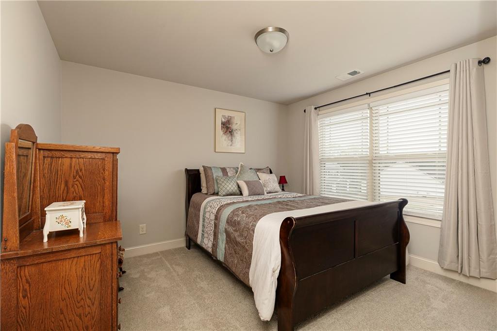 152 Greatwood Lane Villa Rica, GA 30180 - Photo 33 of 48 a bed room with a bed and a window