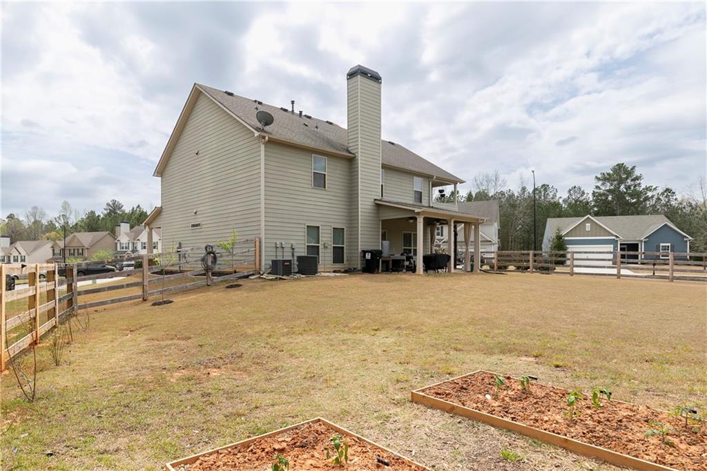 152 Greatwood Lane Villa Rica, GA 30180 - Photo 42 of 48 a front view of a house with a yard and seating area