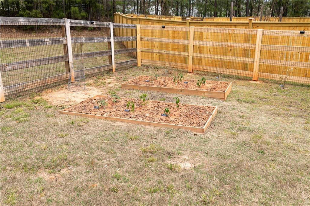 152 Greatwood Lane Villa Rica, GA 30180 - Photo 43 of 48 a view of a backyard of a house with a large tree