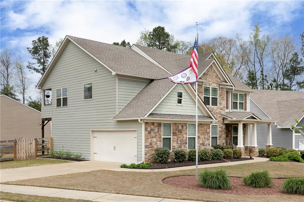 152 Greatwood Lane Villa Rica, GA 30180 - Photo 47 of 48 a view of a white house with large windows and a yard