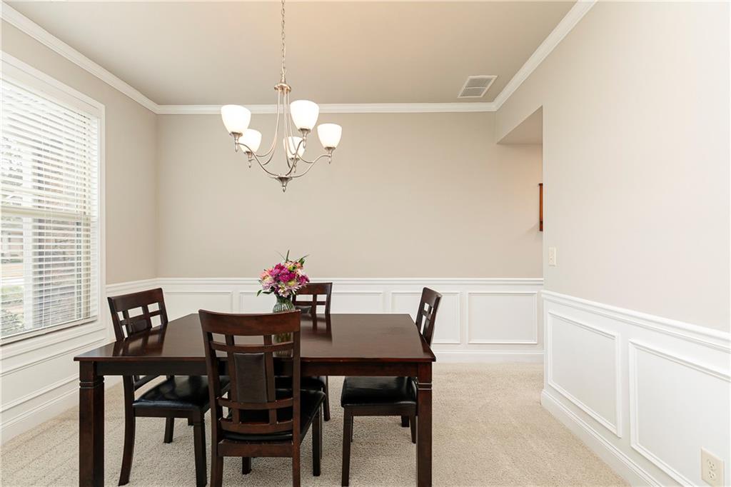 152 Greatwood Lane Villa Rica, GA 30180 - Photo 6 of 48 a view of a dining room with a table and chairs