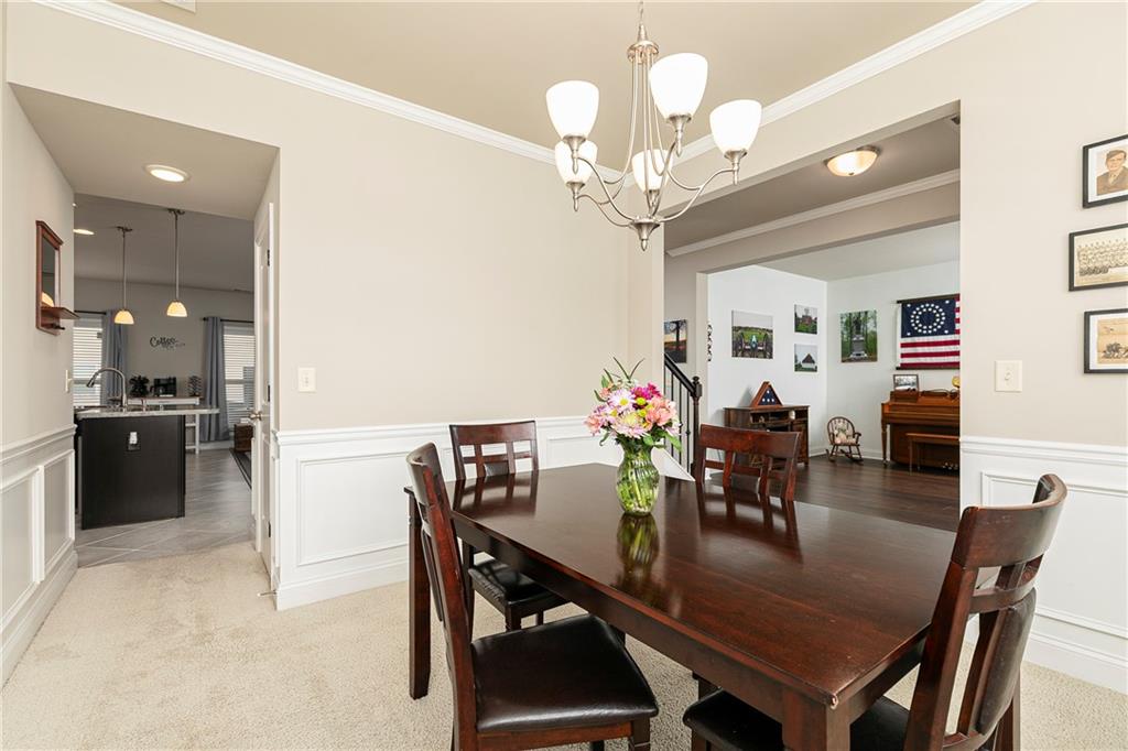 152 Greatwood Lane Villa Rica, GA 30180 - Photo 8 of 48 a view of a dining room with furniture and chandelier