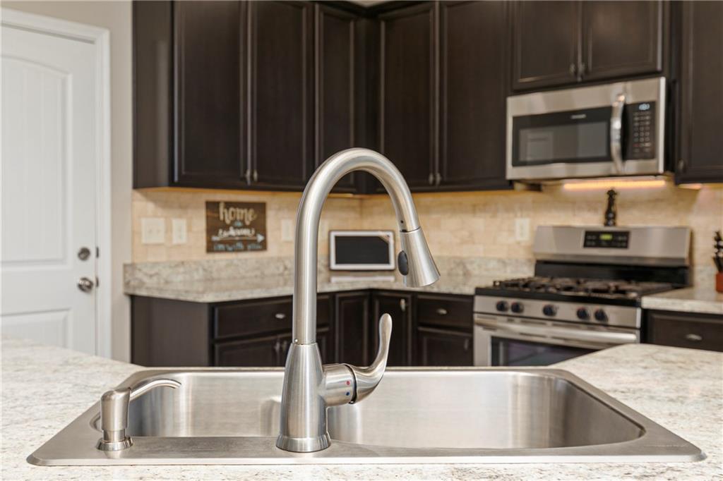152 Greatwood Lane Villa Rica, GA 30180 - Photo 10 of 48 a kitchen with granite countertop a stove and a sink