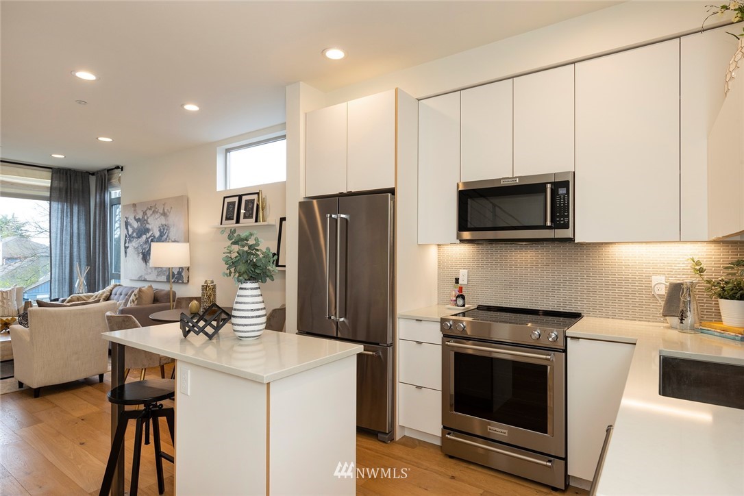 6012 A California Avenue Southwest Seattle, WA 98136 - Photo 11 of 30 a kitchen that has a sink and a stove top oven