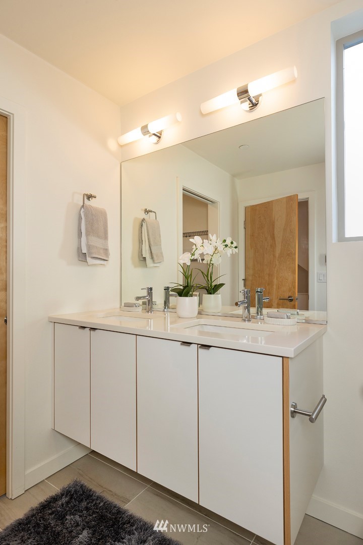 6012 A California Avenue Southwest Seattle, WA 98136 - Photo 17 of 30 a bathroom with a sink and a mirror