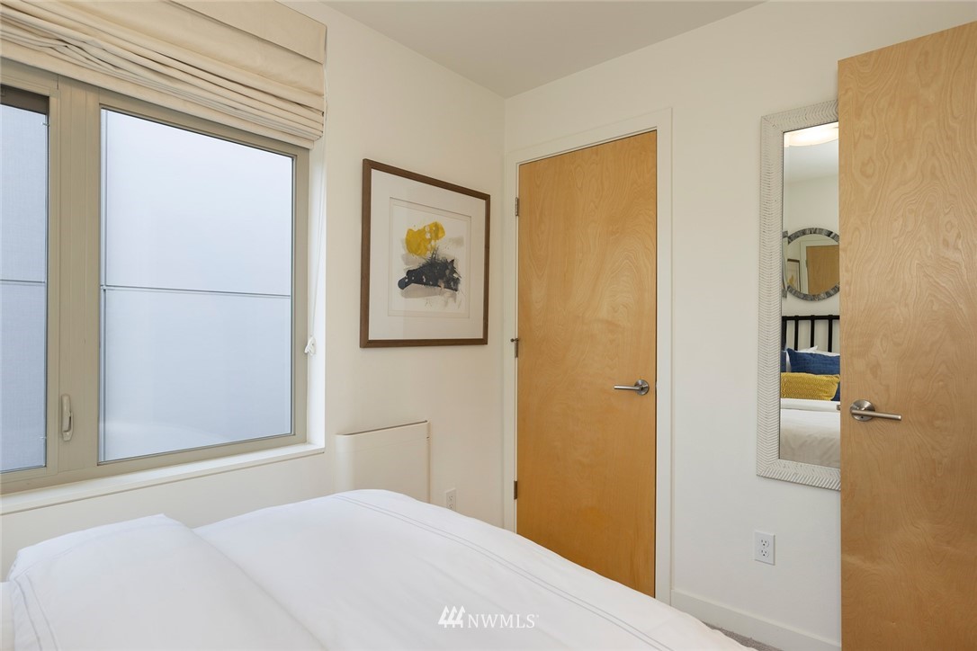 6012 A California Avenue Southwest Seattle, WA 98136 - Photo 20 of 30 a bedroom with a bed and a window