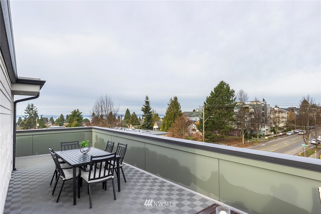 6012 A California Avenue Southwest Seattle, WA 98136 - Photo 22 of 30 a view of a chairs and table in the balcony