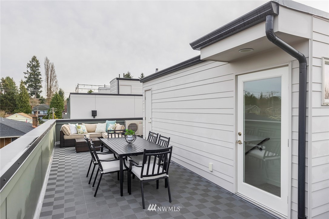 6012 A California Avenue Southwest Seattle, WA 98136 - Photo 24 of 30 a view of a dinning table and chairs in patio of the house